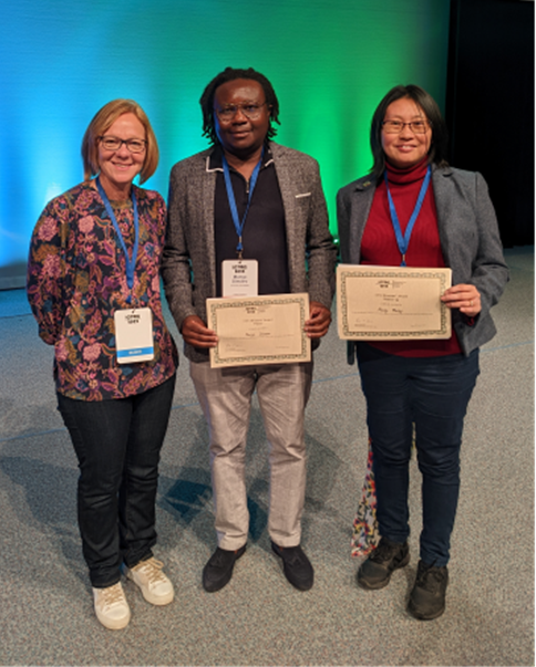 Munya Dimairo (centre) collecting his award from Julia Brown (left).  Shown with Macey Murray (right)